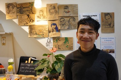 Kim, with his drawings, Casa Blanca Hostel